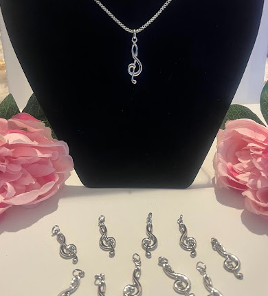 Silver treble clef pendant