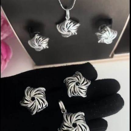 Silver earrings and pendant set